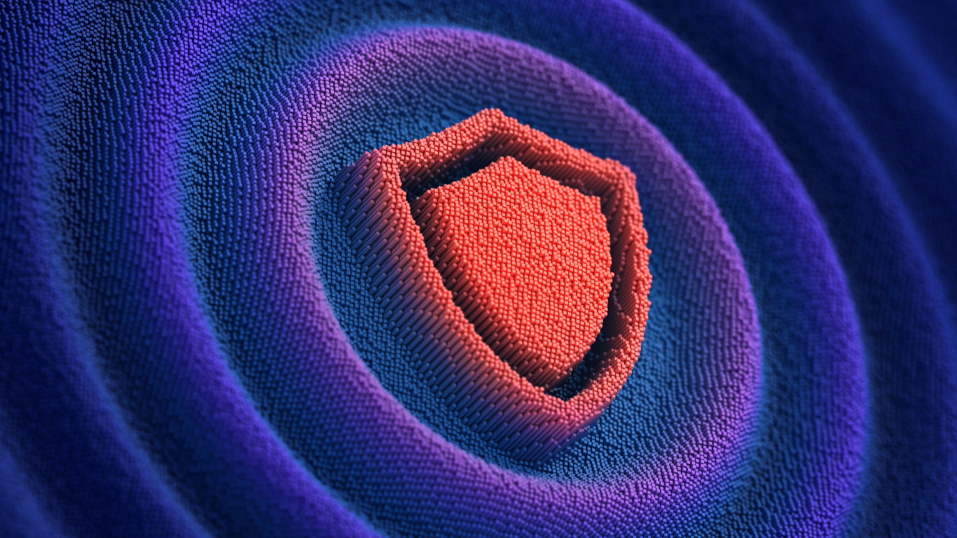 Unified shield icon at the center of concentric rings, illustrating consolidated cyber resilience