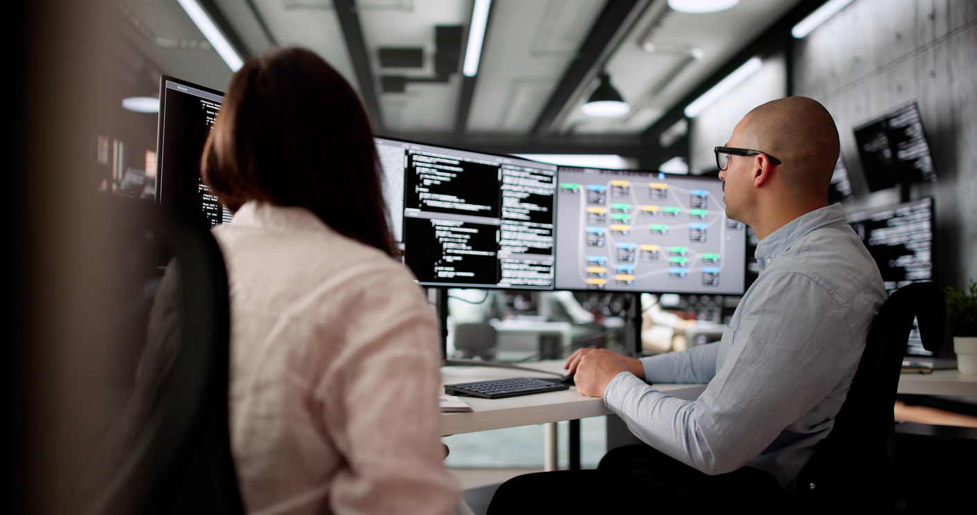 Developers reviewing code and architecture during application modernization services